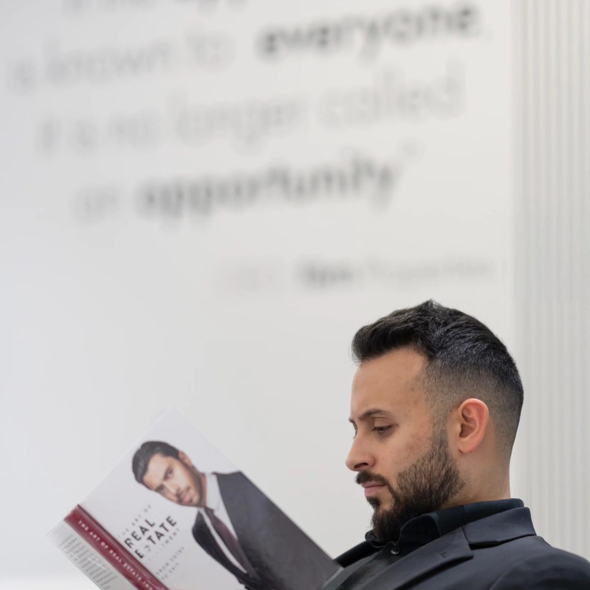 Mo Daas reviewing real estate material at fäm Properties