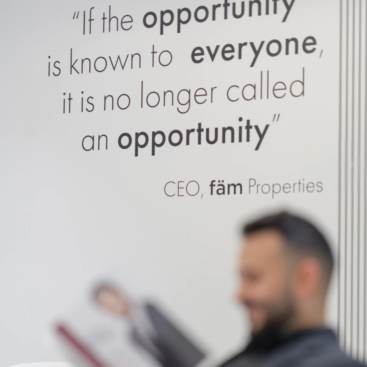 Quote wall at the fäm Properties office in Dubai