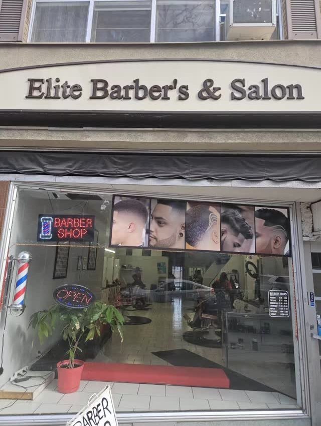 The Elite Barber's and Salon storefront on Dundas Street West, with its sign and barber pole