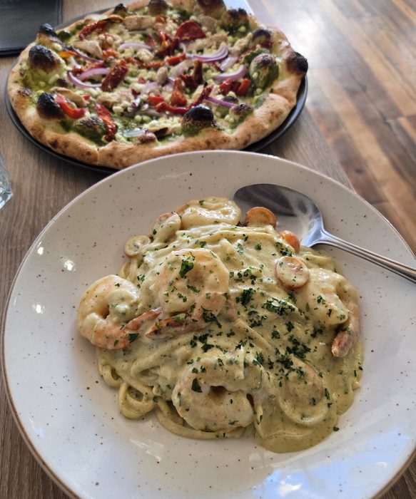 Shrimp linguine with a pizza for the table