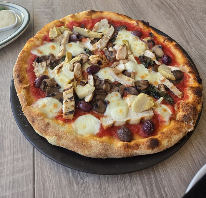 Wood-fired pizza with mushroom and artichoke