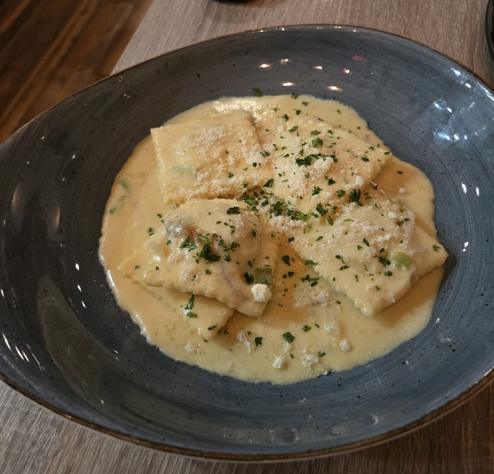 Handmade ravioli in cream sauce